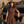Carica l'immagine nel visualizzatore Galleria, Shimmering Mocha Women's Outfit with metallic bow details and matching midi skirt, styled with horses for Mama Luma’s Altai Morin Collection.
