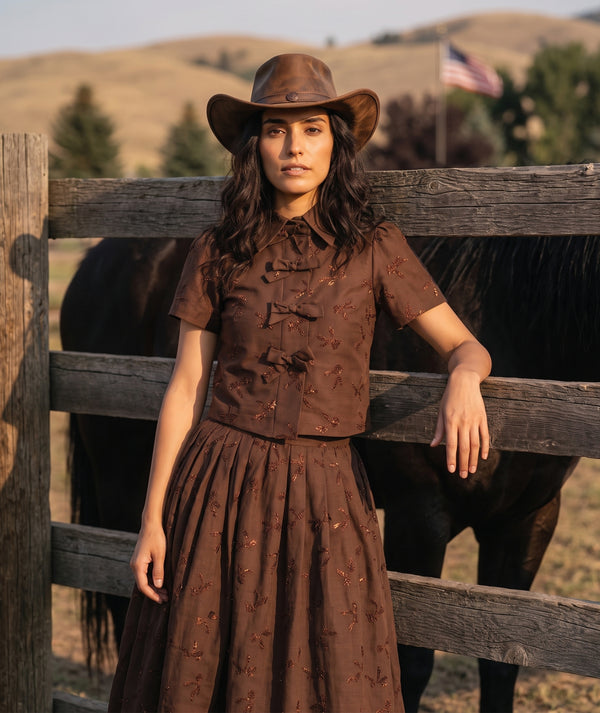 Shimmering Mocha Women's Outfit with metallic bow details and matching midi skirt, styled with horses for Mama Luma’s Altai Morin Collection.