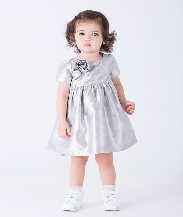 Silver baby dress (12–36M) in satin with 3D rose detail – perfect for weddings, christenings, milestone birthdays, and portraits
