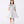 Charger l'image dans la galerie, Front view of the Silver Flower Detail Event Dress by Mama Luma, showcasing a luminous silver satin finish with a dramatic floral appliqué at the shoulder. The structured yet flowing silhouette captures elegance and movement—ideal for galas, weddings, and family celebrations.
