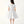 Charger l'image dans la galerie, Front view of silver satin women’s dress with oversized sculptural flower on the shoulder – sophisticated evening and event dress by Mama Luma.
