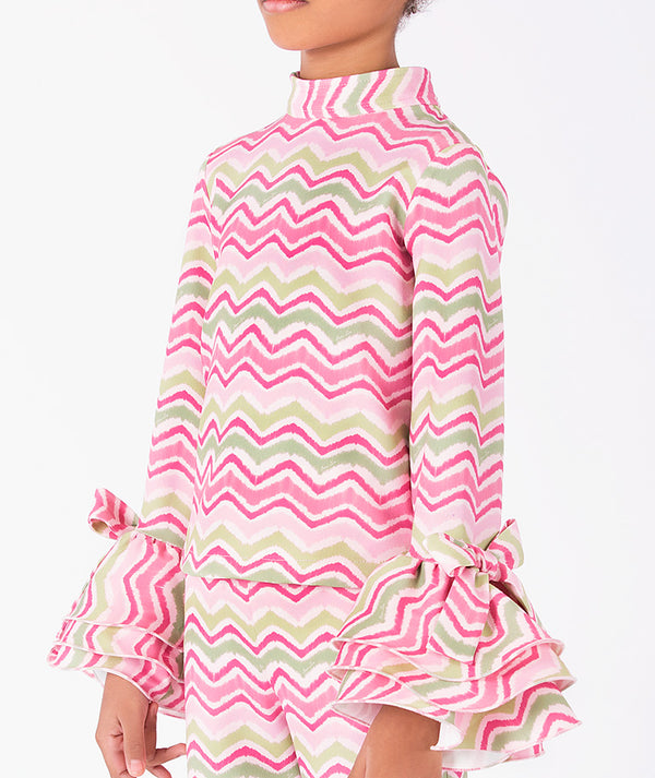 Editorial view of Strawberry Girls Zigzag Outfit | 2 Pieces in green jacquard for girls ages 3 to 12, featuring fabric texture and color