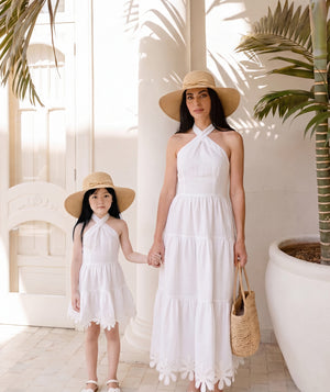Editorial view of Sun Appliqués Linen Women's Dress, featuring fabric texture and color