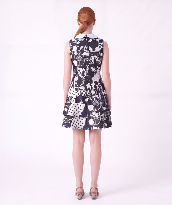 Back view of the Suva Maia Collared Women’s Dress featuring a navy and ivory botanical print, contrast collar, and structured silhouette by Mama Luma.