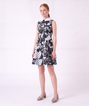 Front view of the Suva Maia Collared Women’s Dress in navy and ivory with a contrast collar and layered skirt by Mama Luma.