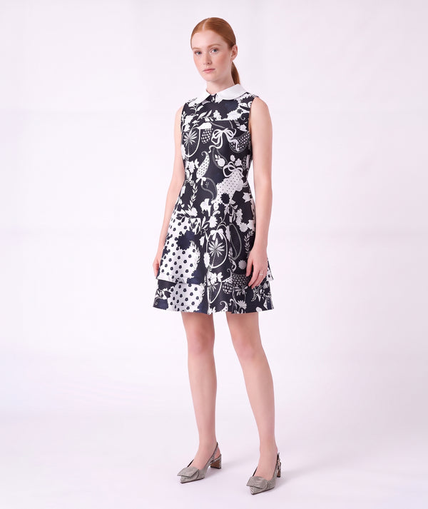 Front view of the Suva Maia Collared Women’s Dress in navy and ivory with a contrast collar and layered skirt by Mama Luma.