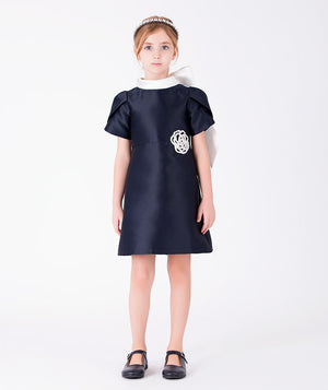 Front view of Suva Maia Flower Girls Dress in ivory satin for girls ages 3 to 12, a premium children’s design by Mama Luma