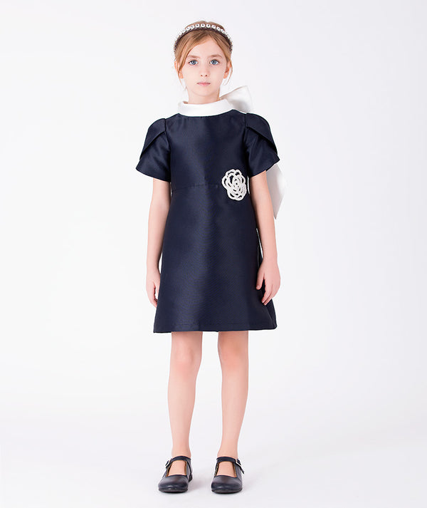 Front view of Suva Maia Flower Girls Dress in ivory satin for girls ages 3 to 12, a premium children’s design by Mama Luma