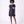 Load image into Gallery viewer, Front view of the Suva Maia Flower Women’s Dress in navy featuring an ivory high collar and sculptural flower appliqué by Mama Luma.
