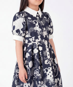 Close-up of Suva Maia Girls Dress in ivory for girls ages 3 to 12, highlighting fabric texture and designer details