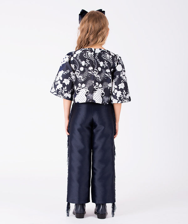 Back view of Suva Maia Girls Tassel Outfit | 2 Pieces in ivory for girls ages 3 to 12, showing the silhouette and refined construction