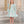 Load image into Gallery viewer, 8 YEARS OLD girl in a floral dress standing in an elegant interior setting.
