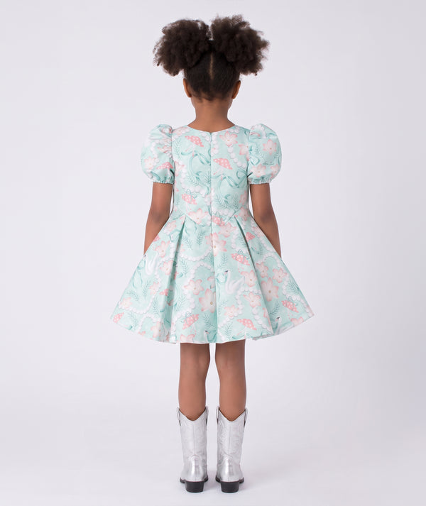 Back view of Swan Pearl Short Sleeve Girls Dress in ivory cotton for girls ages 3 to 12, highlighting tailoring, closure and finishing