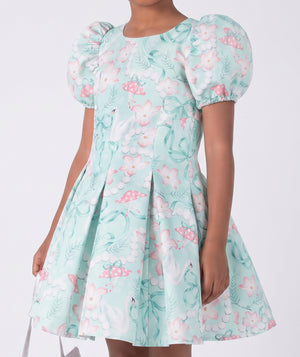 Close-up of Swan Pearl Short Sleeve Girls Dress in ivory cotton for girls ages 3 to 12, highlighting tailoring, closure and finishing
