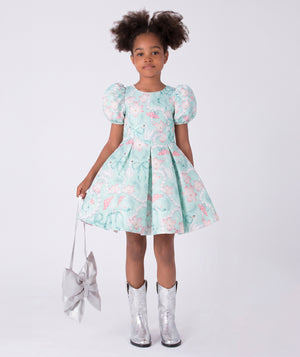Front view of Swan Pearl Short Sleeve Girls Dress in ivory cotton for girls ages 3 to 12, showing overall silhouette and styling
