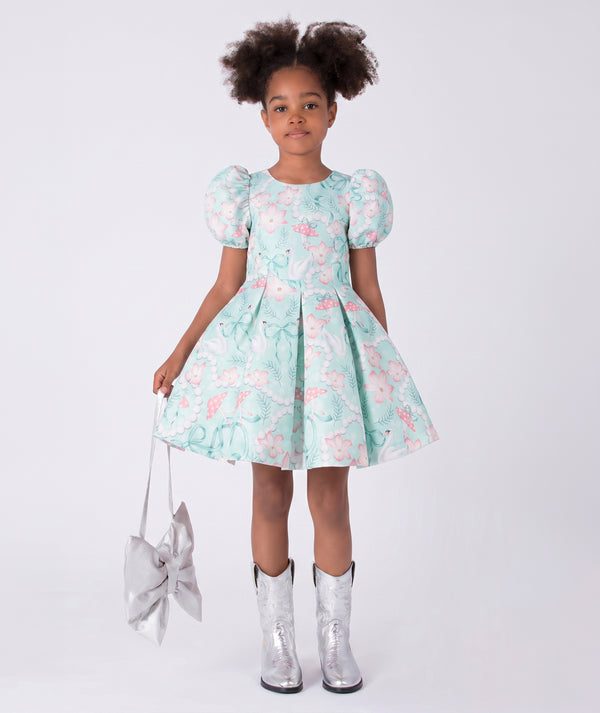 Front view of Swan Pearl Short Sleeve Girls Dress in ivory cotton for girls ages 3 to 12, showing overall silhouette and styling