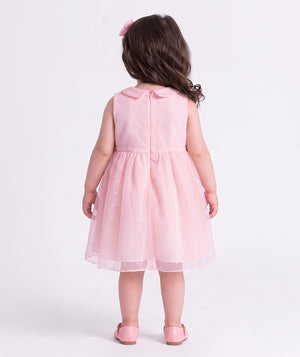 Back view of the Swiss Dot Pink Baby Girl Dress by Mama Luma, an elegant pink baby dress for birthdays and special occasions.