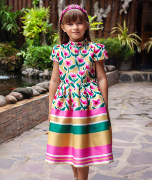 A vibrant floral print dress with playful stripes in green, pink, and yellow