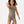 Carica l'immagine nel visualizzatore Galleria, Action lifestyle image of a girl wearing a taupe sleeveless tank top and matching shorts, captured mid-movement for energetic play, active comfort, and everyday athleisure, available in sizes 3–14
