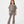 Charger l'image dans la galerie, Front-facing lifestyle image of a girl wearing a taupe cropped short sleeve t-shirt with ribbed flared pants, styled for modern school outfits, relaxed movement, and everyday comfort, available in sizes 3–14
