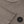 Charger l'image dans la galerie, Close-up detail of a taupe girls long sleeve t-shirt highlighting the sleeve hem, neckline, soft knit texture, and minimalist chest emblem, designed for everyday wear, school outfits, and casual looks, available in sizes 3–14
