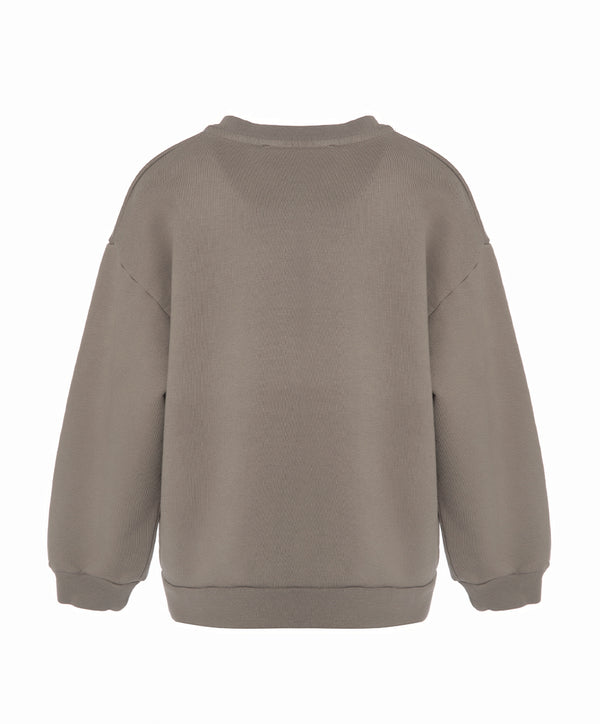 Back view of a taupe girls sweatshirt with a relaxed fit and clean silhouette, designed for everyday wear, school outfits, and casual layering, available in sizes 3–14