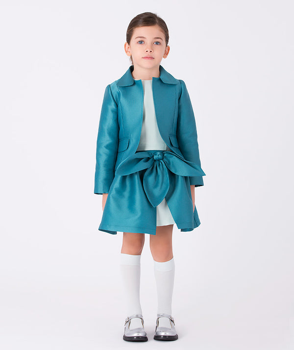 Girl wearing a teal satin jacket and matching bow skirt outfit (3–12Y) — perfect for weddings, family portraits, and elegant festive gatherings