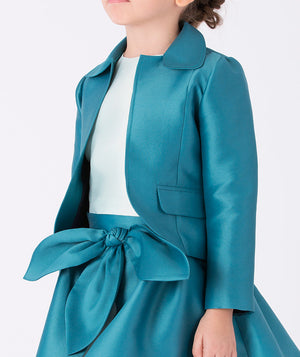 Girl wearing a teal satin jacket with a large matching bow skirt (3–12Y) — a classy outfit ideal for weddings, festive parties, and elegant seasonal gatherings