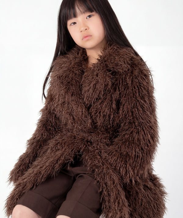 Detail view of Textured Faux Fur Girls Coat featuring rich mocha brown texture, plush collar and matching waist belt by Mama Luma.