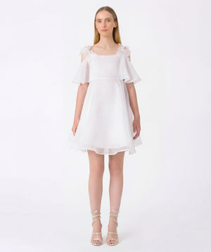 White mini dress with crystal flower shoulder straps and sheer layered flutter sleeves