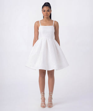 Elegant white textured jacquard dress featuring structured bodice and flared silhouette