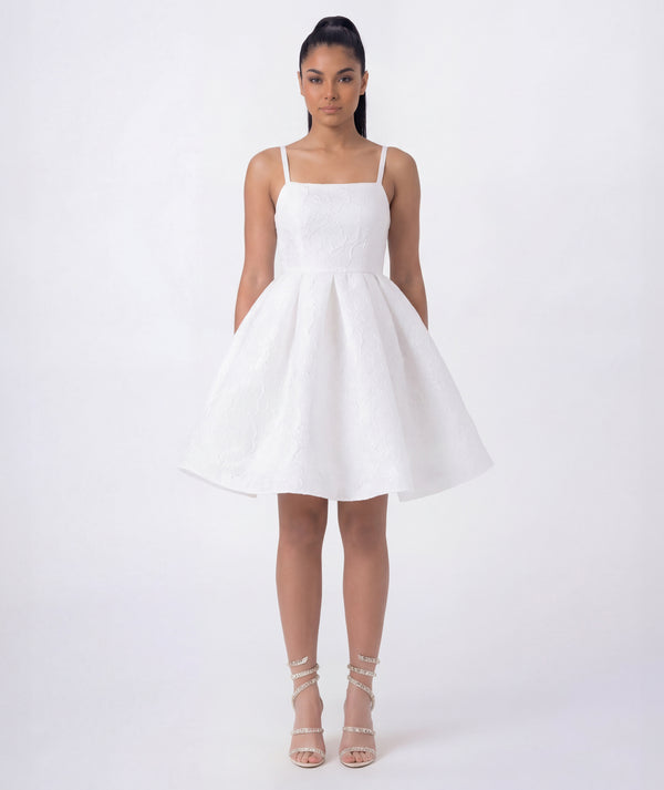 Elegant white textured jacquard dress featuring structured bodice and flared silhouette