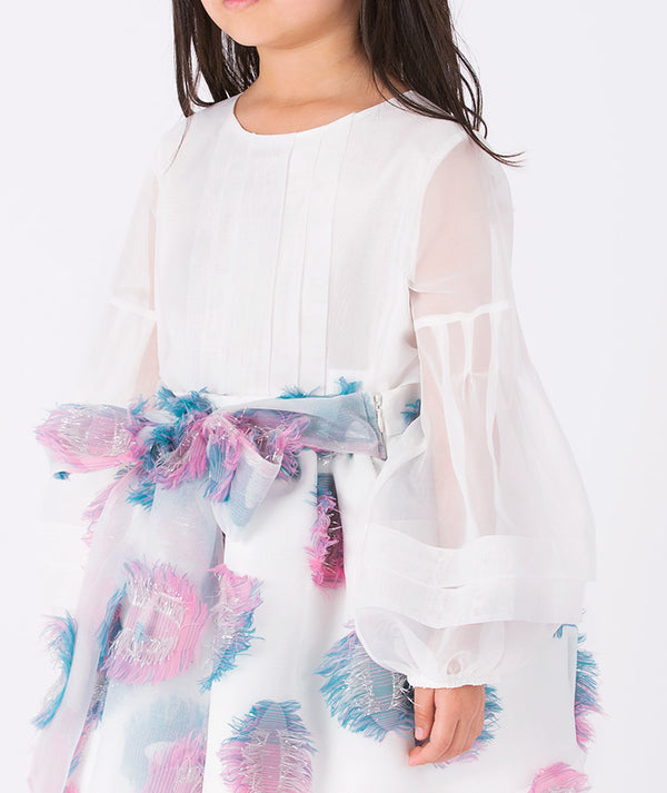 Close-up of girls’ white organza blouse and pastel feathered skirt outfit (3–12Y) with a pink and blue textured bow belt — perfect for weddings, birthdays, and festive celebrations