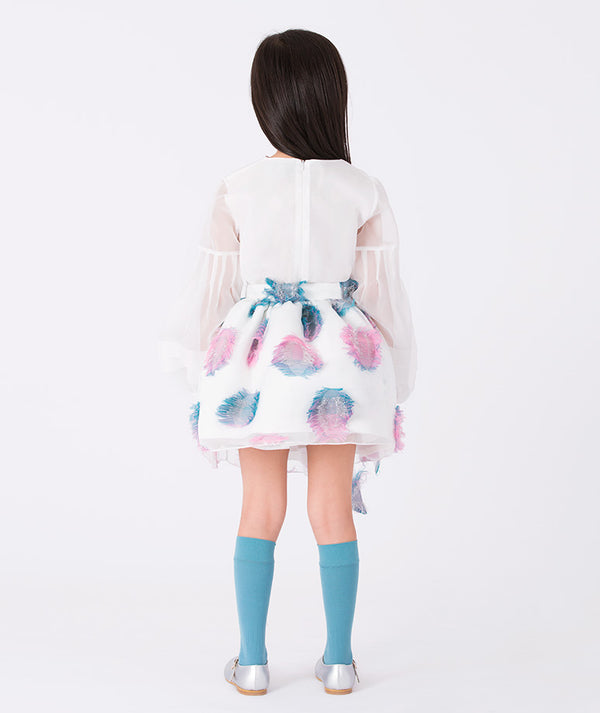 Back view of girls’ white organza blouse and pastel feathered skirt outfit (3–12Y) with pink and blue floral accents — perfect for weddings, birthdays, and elegant celebrations