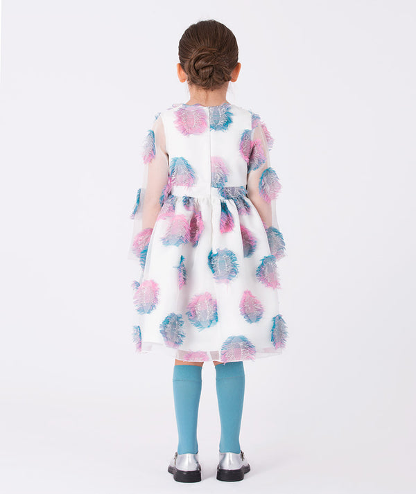 Back view of a white organza girls’ dress (3–12Y) with layered pastel feather appliqués in pink and blue — perfect for weddings, parties, and spring celebrations