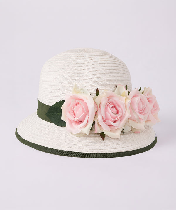 Editorial view of White Rose Girls Sun Hat in blush pink for girls ages 3 to 12, featuring fabric texture and color