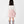 Load image into Gallery viewer, Rear view of a white long-sleeve girls' top and pink embroidered tulle skirt, showcasing the clean fit and minimalist design for formal or casual kids' wear.
