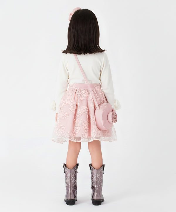 Rear view of a white long-sleeve girls' top and pink embroidered tulle skirt, showcasing the clean fit and minimalist design for formal or casual kids' wear.