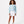 Load image into Gallery viewer, Girl wearing a light blue sweatshirt and white shorts, styled for everyday athleisure, school days, and active play, available in sizes 3–14
