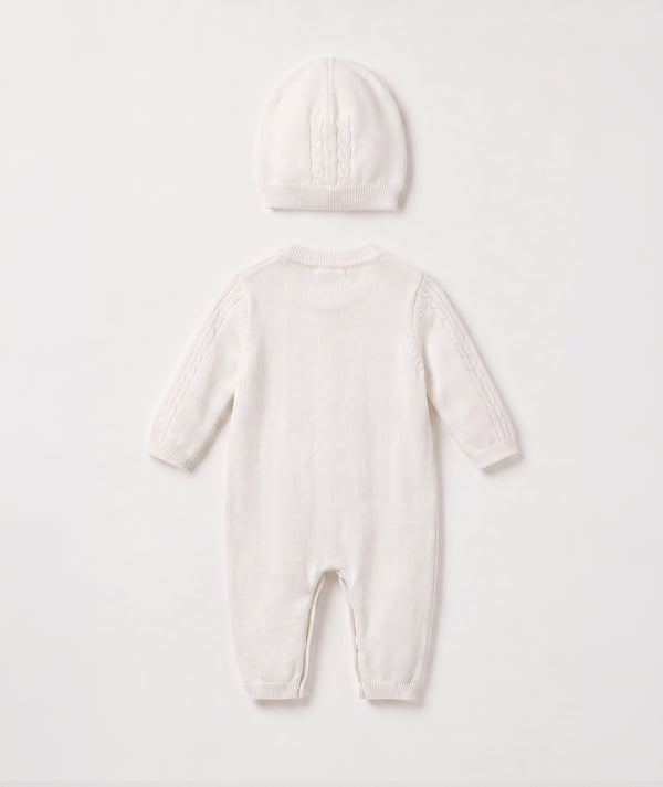 Ivory cable knit baby romper with matching beanie luxury newborn knit outfit perfect for special occasions
