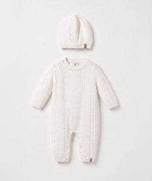 Ivory cable knit baby romper with matching beanie luxury newborn knit outfit perfect for special occasions