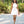 Load image into Gallery viewer, Woman wearing a white floral summer dress in a garden
