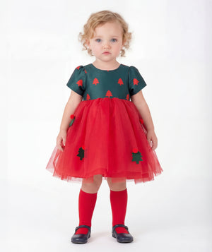 Front view of Mama Luma Floral Appliqué Baby Girl Tulle Dress with a forest-green Christmas tree bodice, layered red tulle skirt, and 3D embellishments.