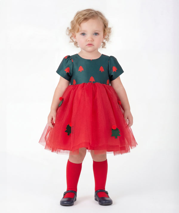 Front view of Mama Luma Floral Appliqué Baby Girl Tulle Dress with a forest-green Christmas tree bodice, layered red tulle skirt, and 3D embellishments.