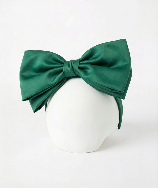 Front view of Mama Luma Matching Green Girls Headband featuring an oversized layered emerald-green bow with a wrapped center knot from the Zermatt Collection.